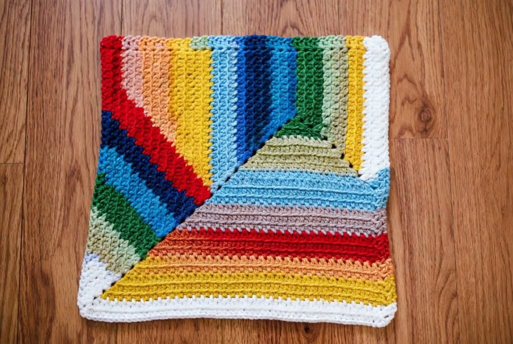 Corner-to-corner crochet blanket pattern worked diagonally in block design, easy beginner C2C throw.