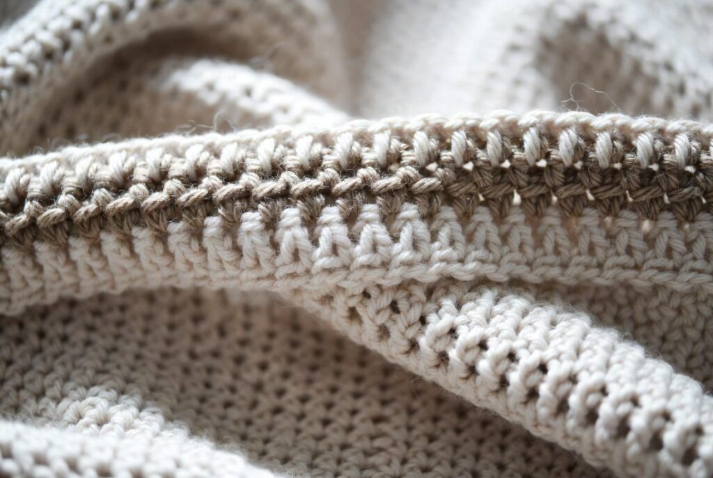 close-up of moss stitch crochet blanket border showing textured single crochet and chain stitch edging