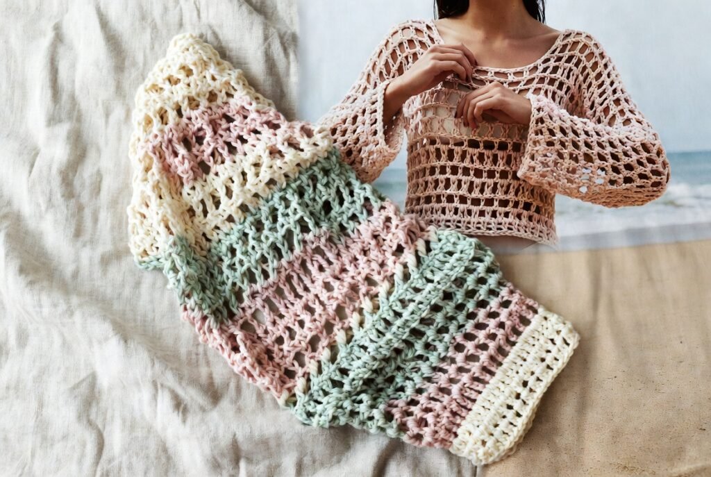 Handmade lightweight crochet summer sweater in pastel yarn.